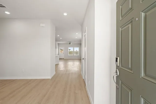 a view of entryway with wooden floor
