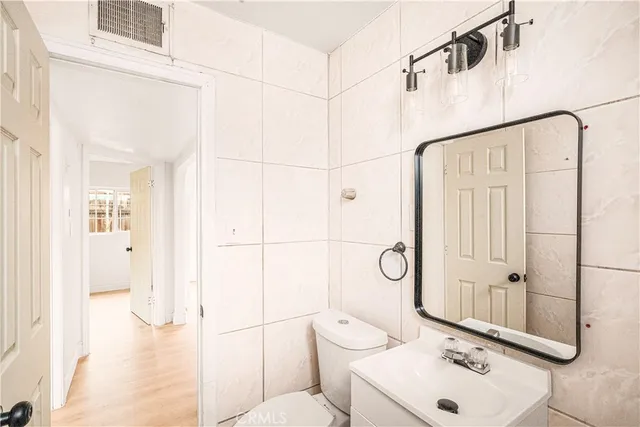 a bathroom with a toilet sink and shower