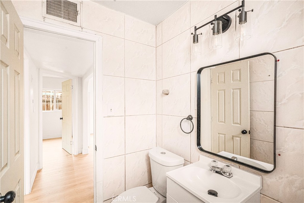 407 4th Street Bakersfield, CA 93304 - Photo 22 of 31 a bathroom with a toilet sink and shower