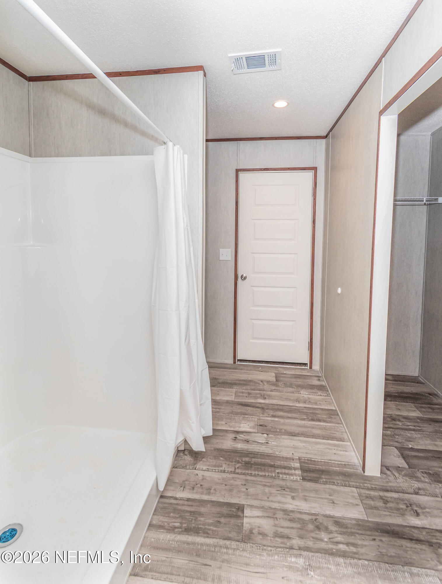 22517 Baxter Grade Road Sanderson, FL 32087 - Photo 12 of 28 a view of a hallway with wooden floor and entryway