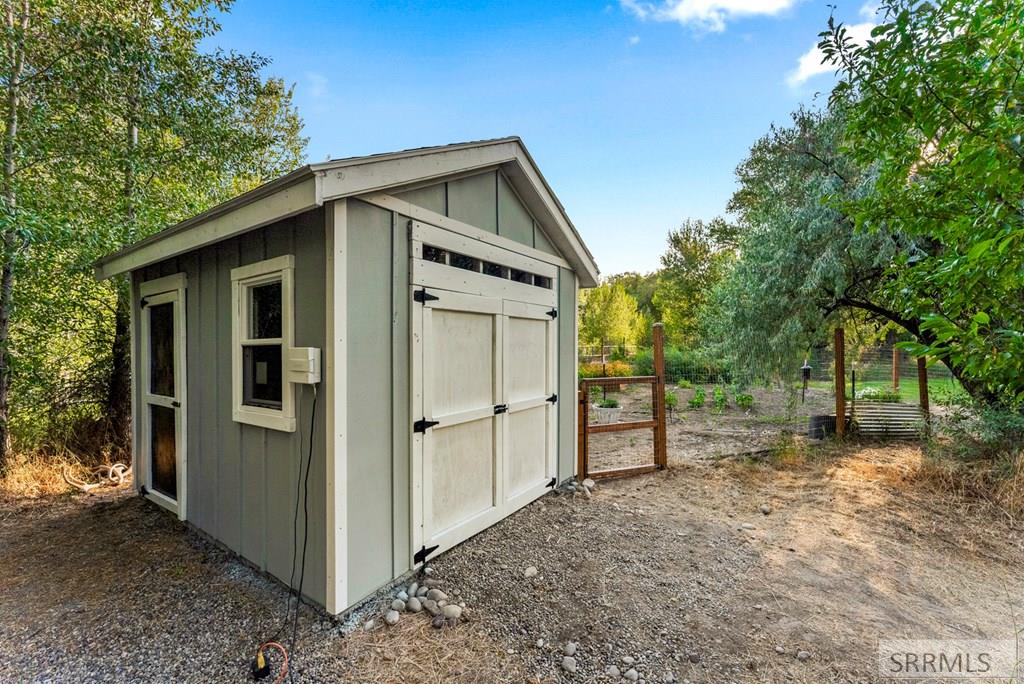 327 4410 East Rigby, ID 83442 - Photo 13 of 68 Garden with Shed and fencing