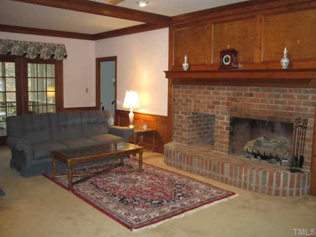 5616 North Hawthorne Way Raleigh, NC 27613 - Photo 4 of 12 Really large family room for spacious entertaining and family gatherings! Masonry fireplace with raised hearth, gas logs and firewood box. To have wood burning FP, there is an ash-dump and a back door to load woodbox opening to the garage . Den/Family/Great Room