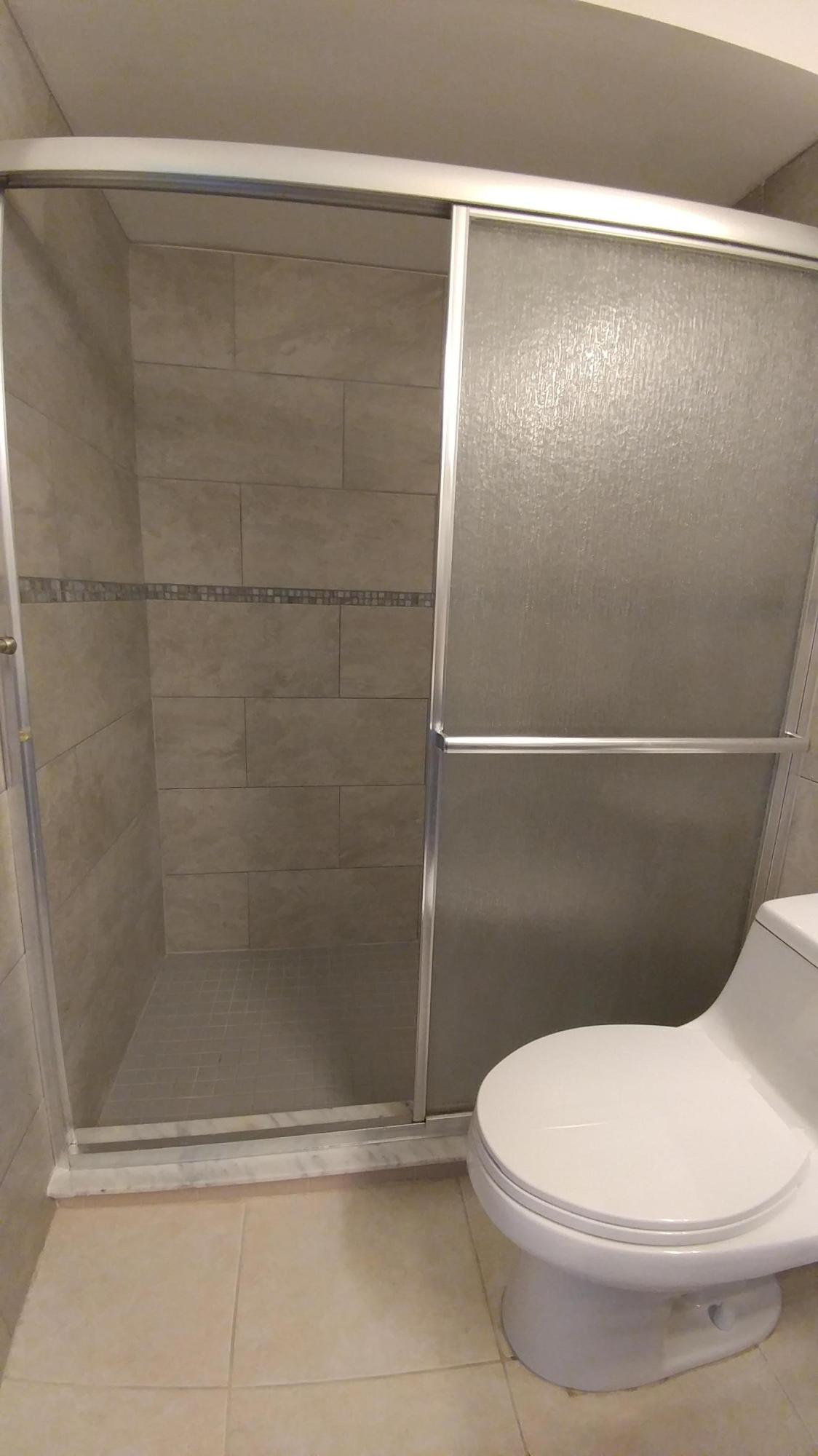 650 Northwest Selvitz Road Port St. Lucie, FL 34983 - Photo 18 of 24 a bathroom with a toilet and a shower
