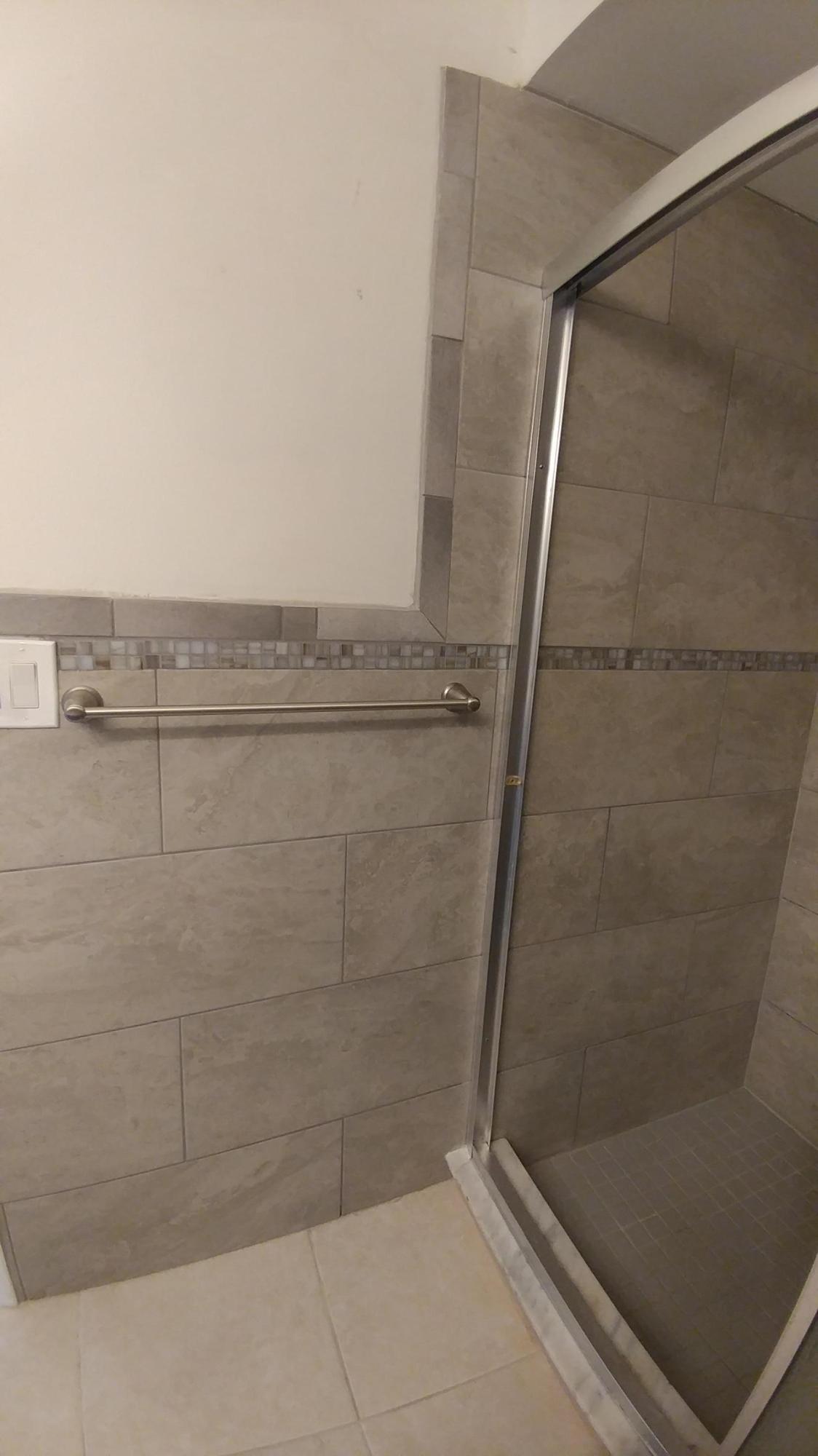 650 Northwest Selvitz Road Port St. Lucie, FL 34983 - Photo 20 of 24 a bathroom with a glass door shower