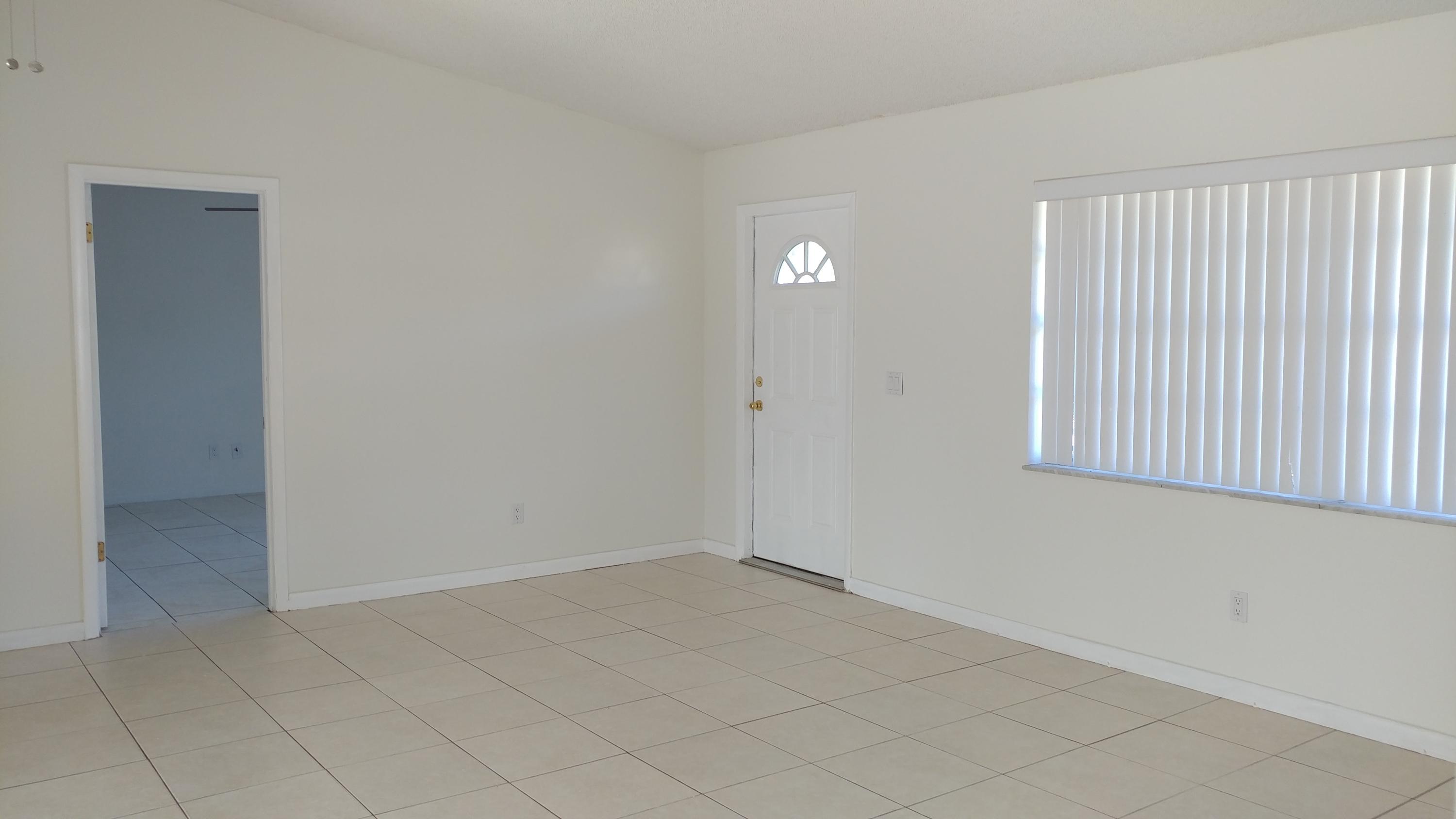 650 Northwest Selvitz Road Port St. Lucie, FL 34983 - Photo 2 of 24 an empty room with windows