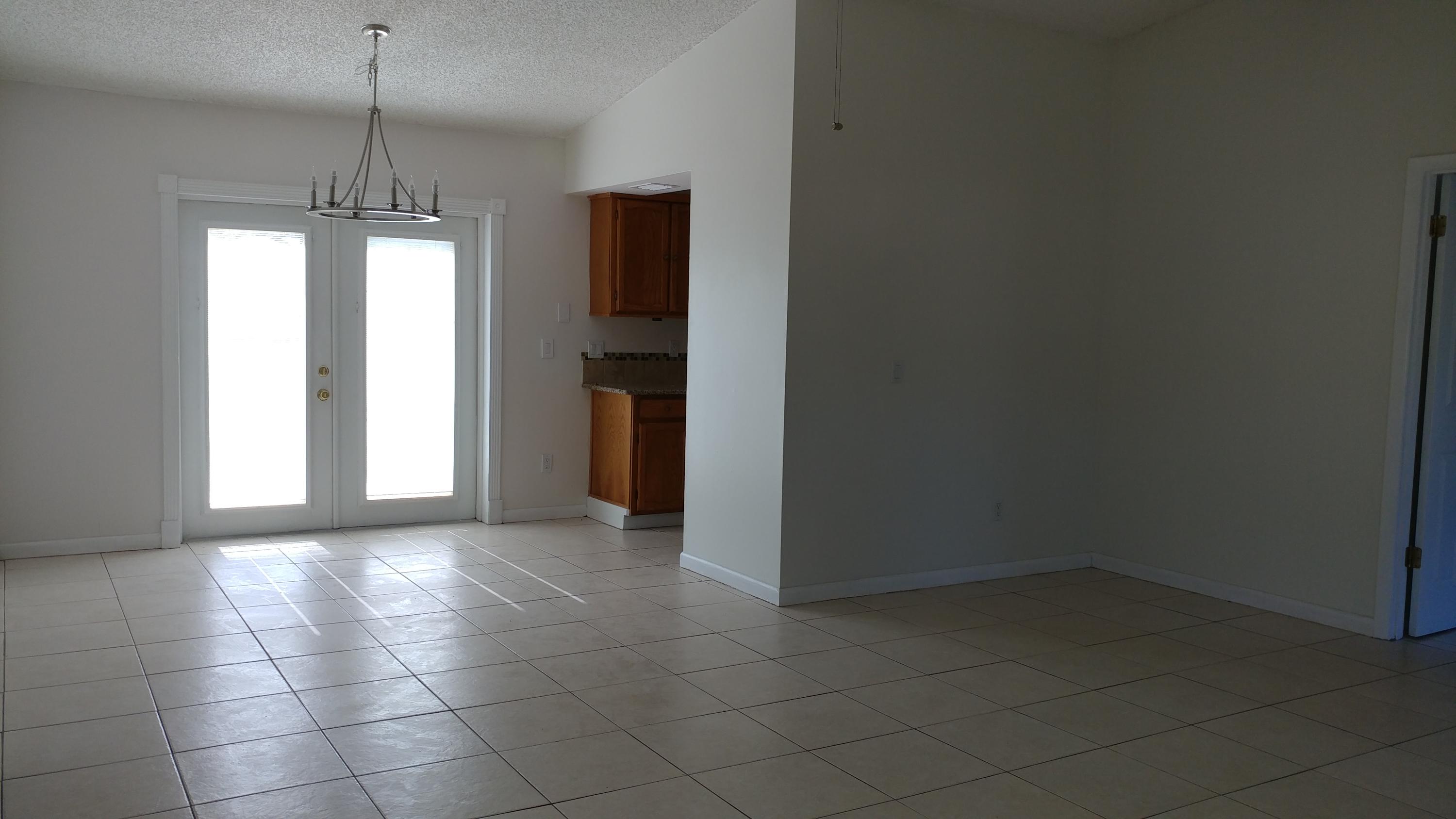 650 Northwest Selvitz Road Port St. Lucie, FL 34983 - Photo 8 of 24 a view of a kitchen with a sink and a window
