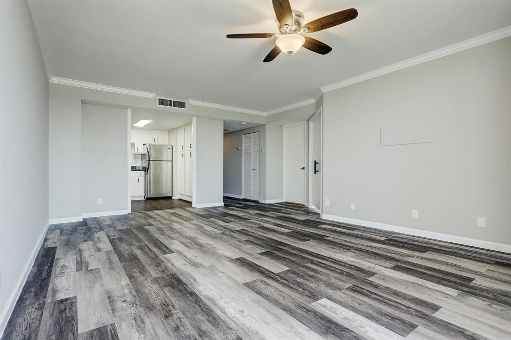 2016 Main Street, Unit 2204 Houston, TX 77002 - Photo 8 of 21 a view of empty room with wooden floor