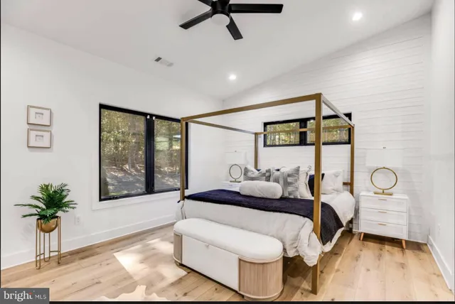 a view of a city with lush green forest