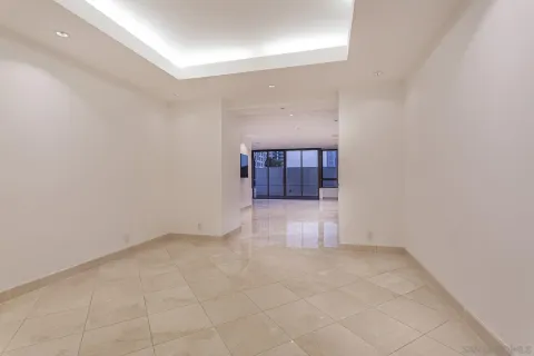 a view of a livingroom with wooden floor and a window