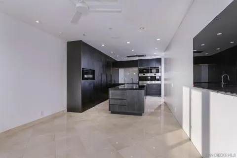 a kitchen with stainless steel appliances kitchen island a refrigerator sink and stove