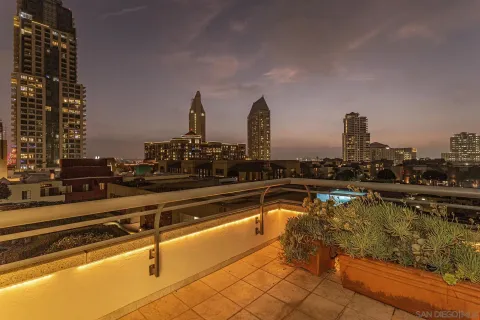 a view of a house with swimming pool and sitting area