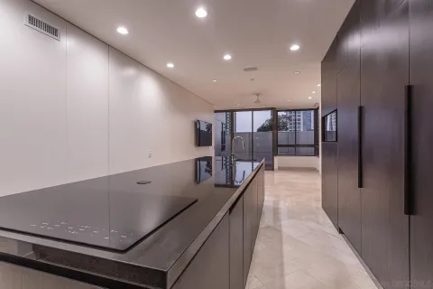 a view of kitchen with stainless steel appliances kitchen area microwave and stove