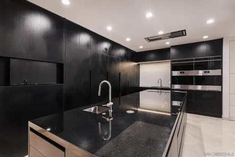 a view of an empty room with a flat screen tv