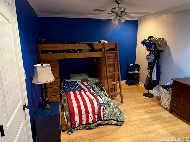a bedroom with a bed and a desk