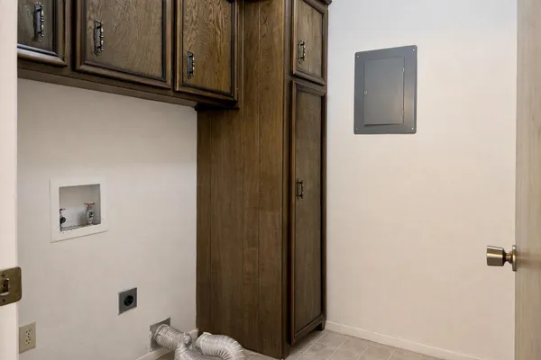 a kitchen with stainless steel appliances granite countertop a refrigerator oven a sink with wooden cabinets and dishwasher