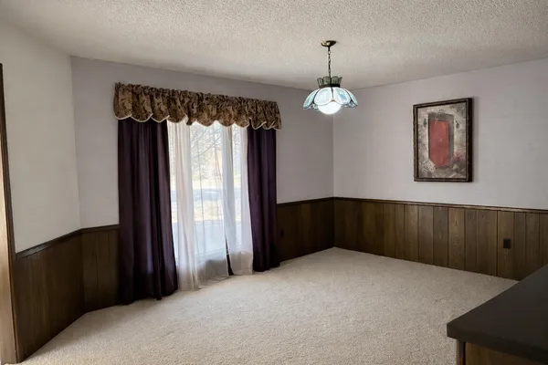 a room with furniture and a flat screen tv