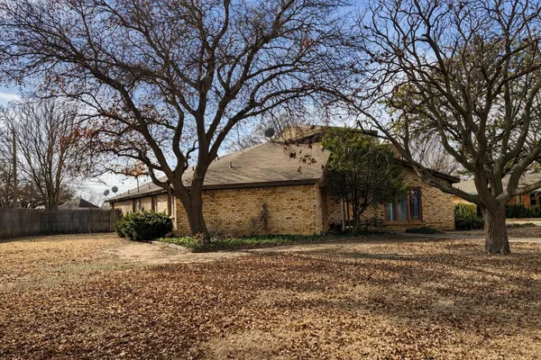 a view of a house with a snow in the yard