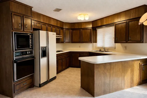 a kitchen with a sink and cabinets