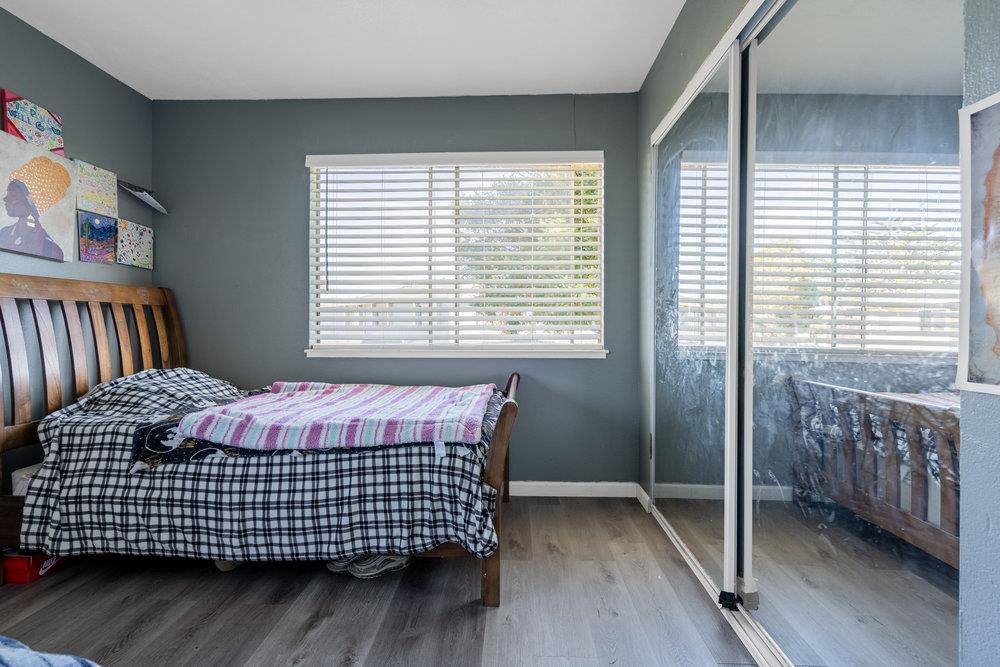 1793 Cherokee Drive, Unit 2 Salinas, CA 93906 - Photo 12 of 20 a bedroom with a bed and wooden floor