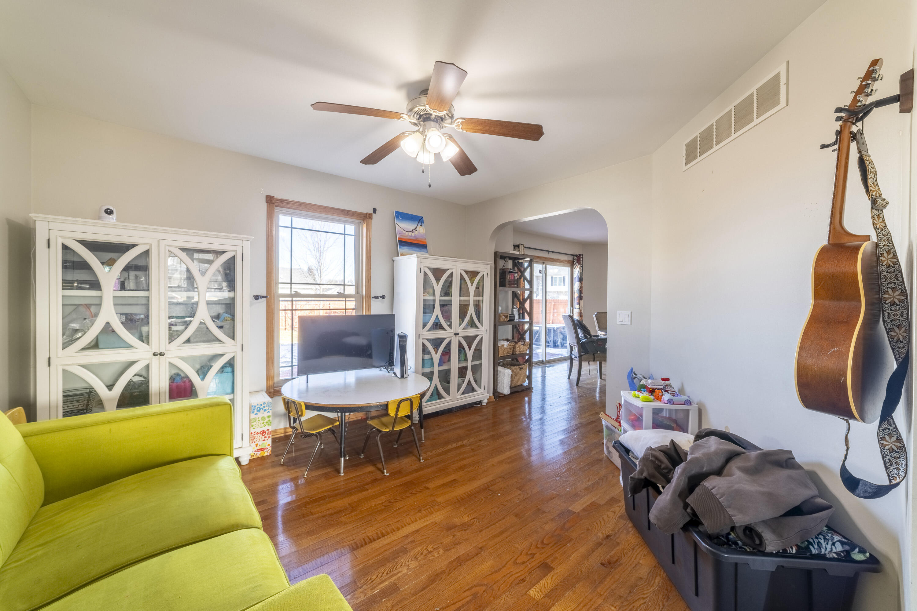704 Coach Light Lane Lowell, IN 46356 - Photo 11 of 34 a living room with furniture and wooden floor