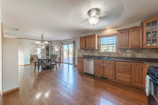 a kitchen with lots of counter space dining table and stainless steel appliances