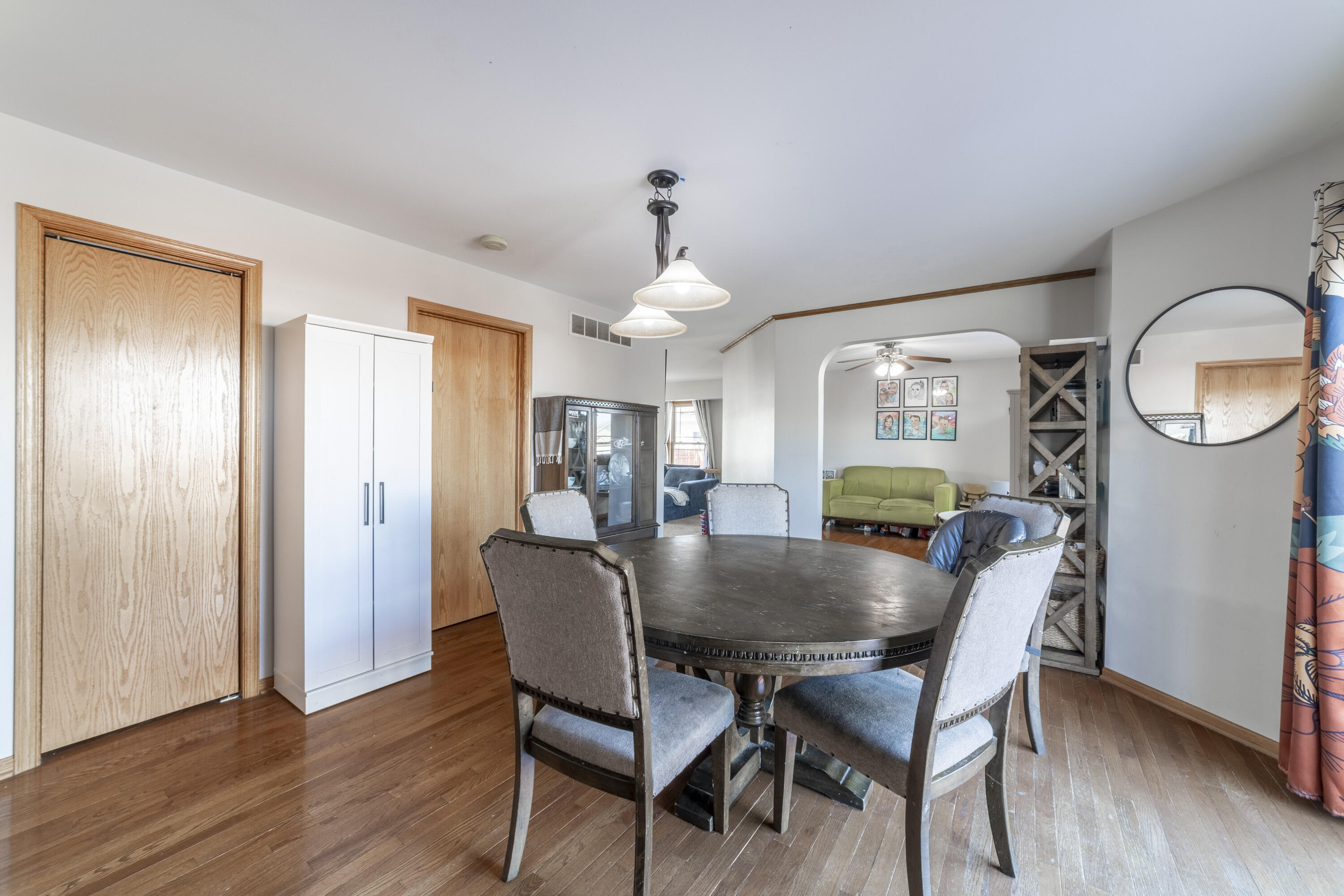 704 Coach Light Lane Lowell, IN 46356 - Photo 16 of 34 a view of a dining room with furniture and a chandelier