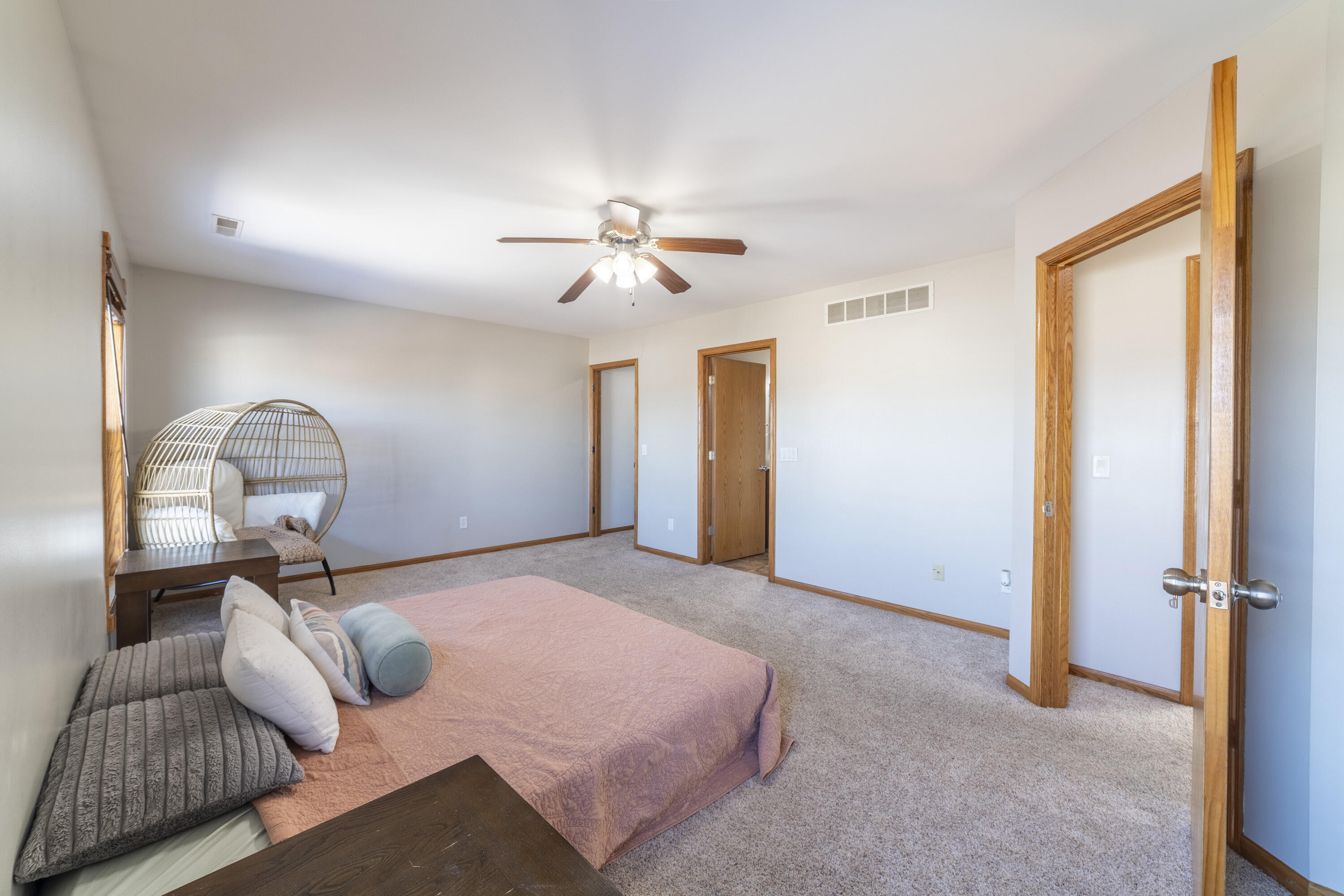 704 Coach Light Lane Lowell, IN 46356 - Photo 18 of 34 a bedroom with furniture and a chandelier