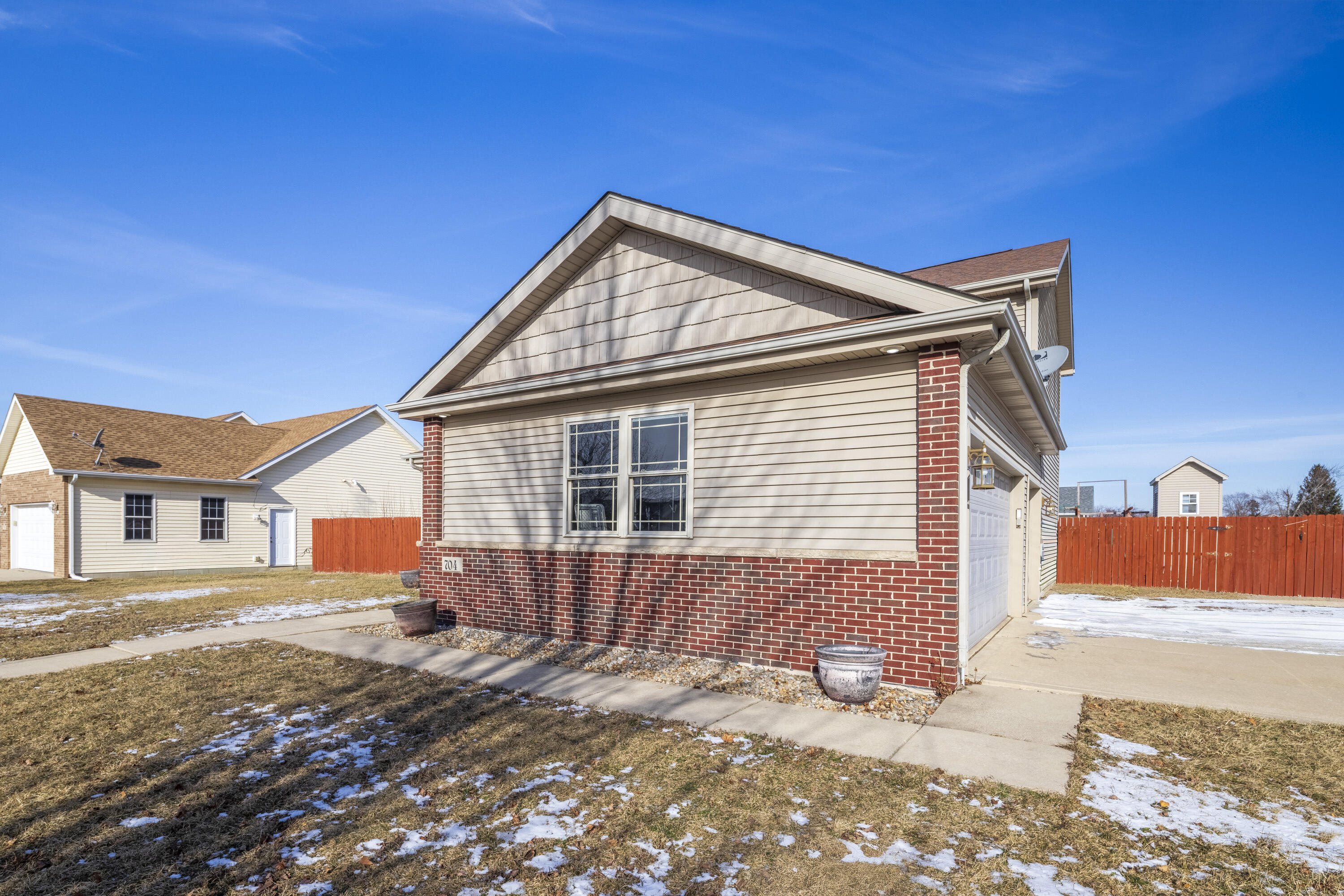 704 Coach Light Lane Lowell, IN 46356 - Photo 5 of 34 a front view of a house with a yard