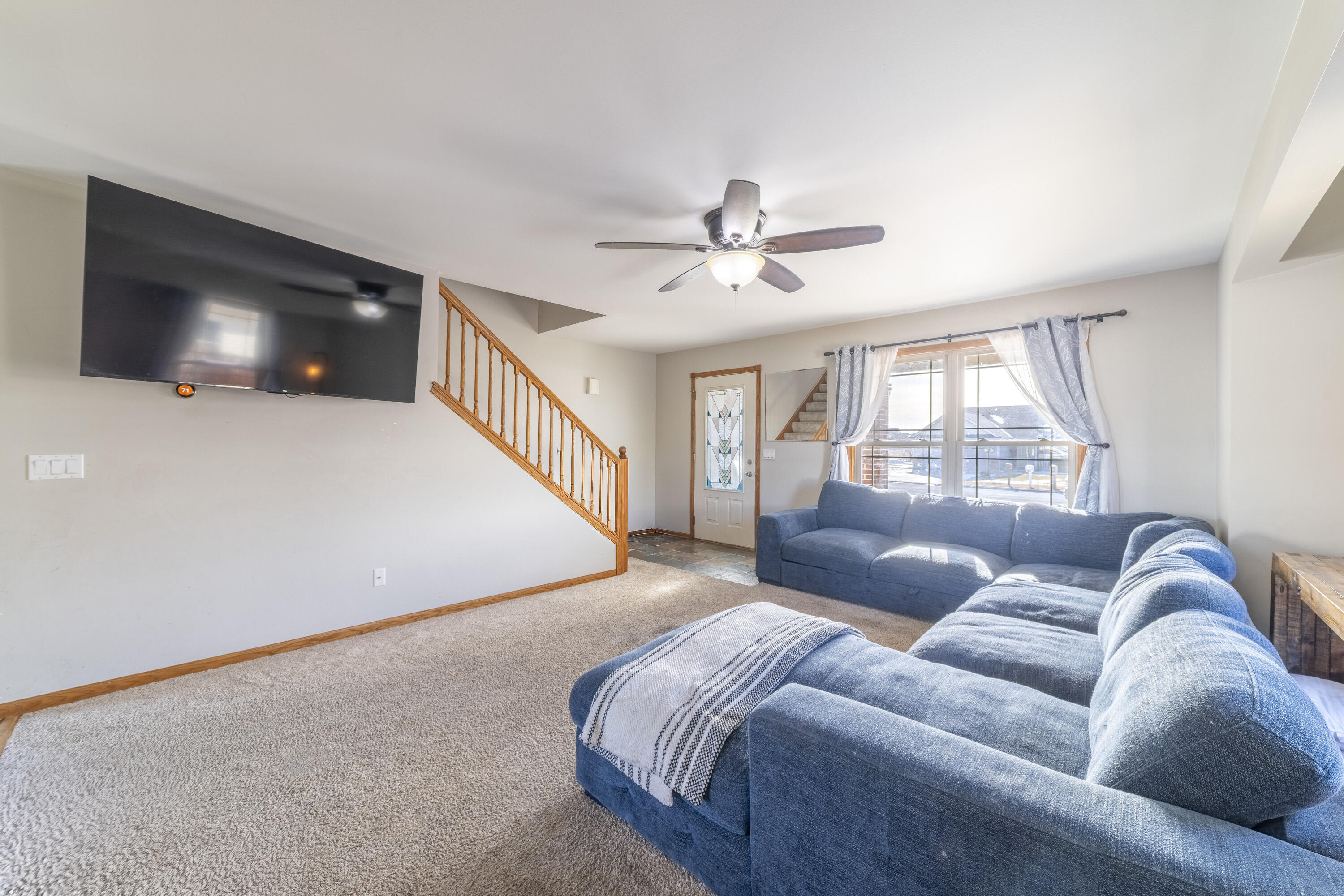 704 Coach Light Lane Lowell, IN 46356 - Photo 7 of 34 a living room with furniture and a flat screen tv