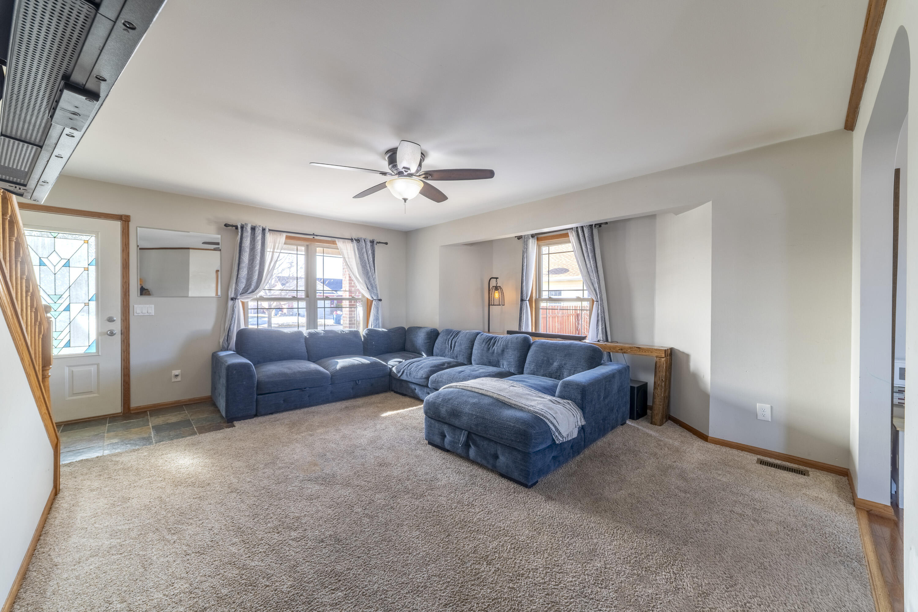 704 Coach Light Lane Lowell, IN 46356 - Photo 8 of 34 a living room with furniture and a window