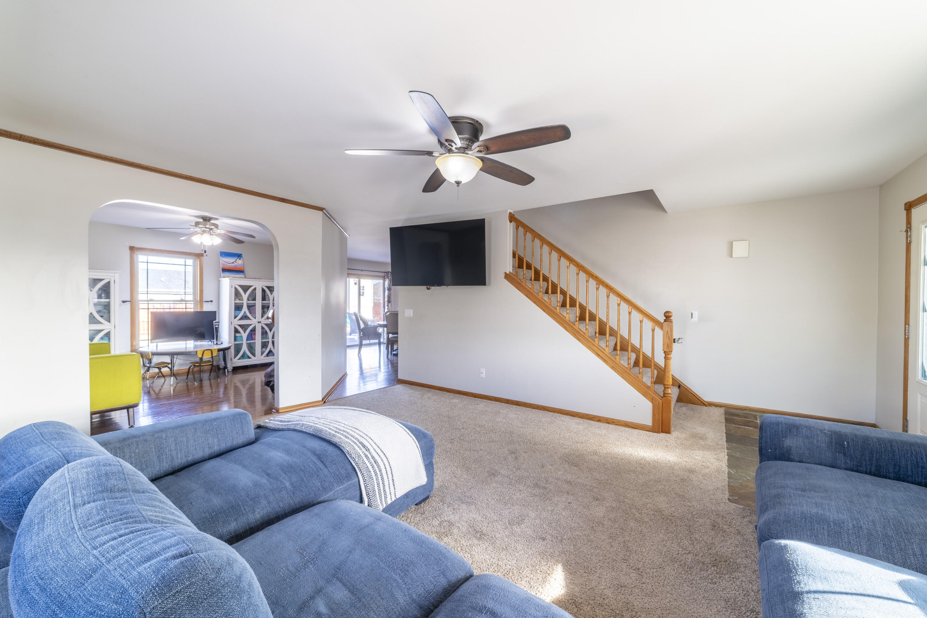 704 Coach Light Lane Lowell, IN 46356 - Photo 9 of 34 a living room with furniture and a ceiling fan