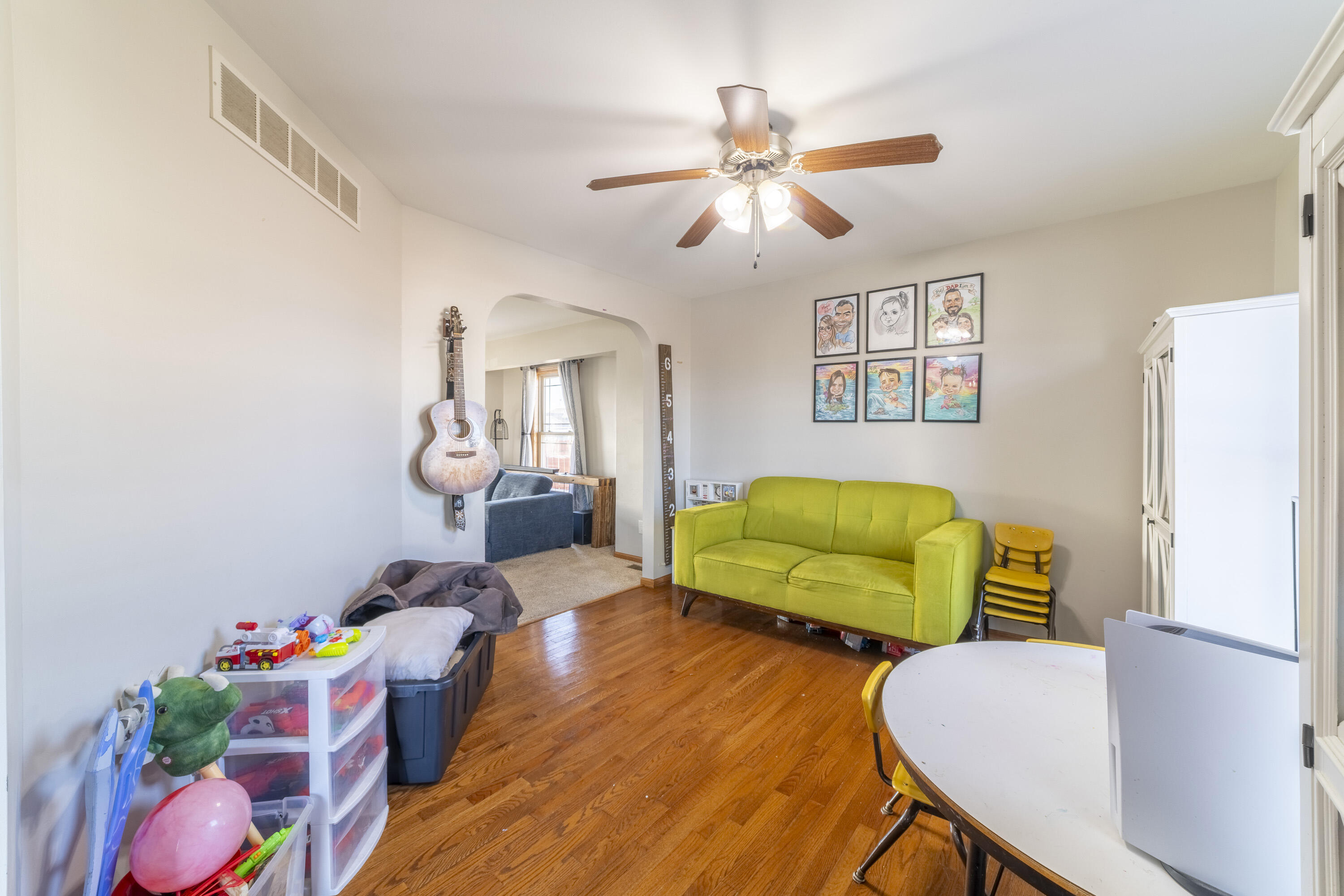 704 Coach Light Lane Lowell, IN 46356 - Photo 10 of 34 a living room with furniture and a wooden floor