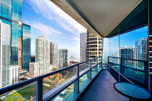 340 East Randolph Street, Unit 2402 Chicago, IL 60601 - Photo 11 of 26 a city view from a balcony