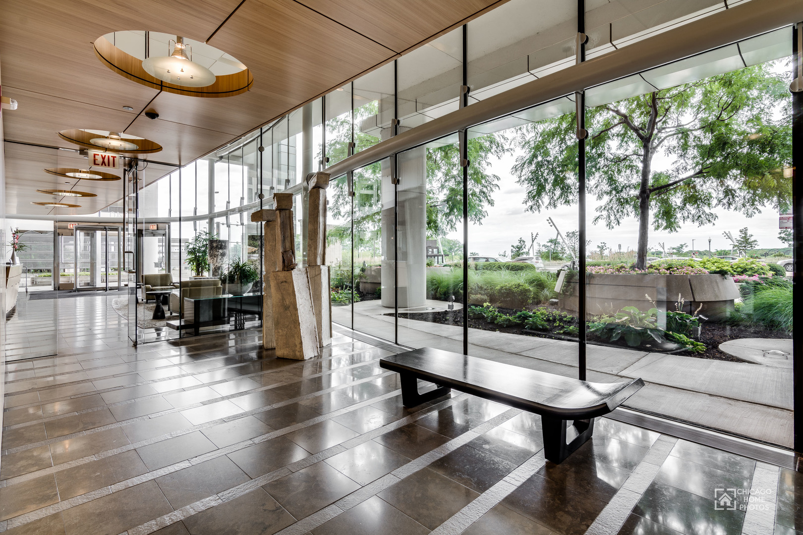 340 East Randolph Street, Unit 2402 Chicago, IL 60601 - Photo 24 of 26 a view of a dining room with furniture wooden floor and a potted plant
