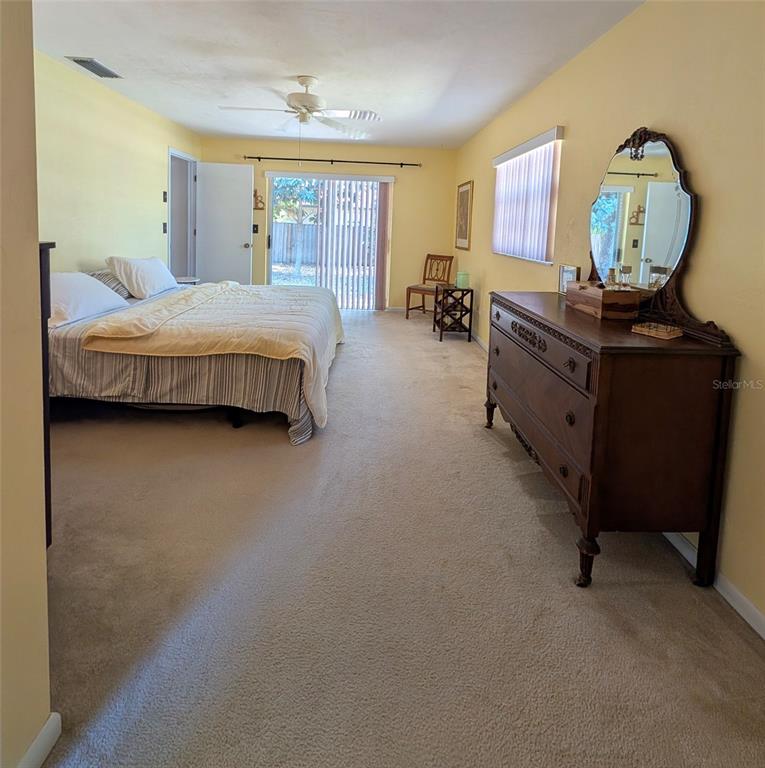 148 Serena Road DeBary, FL 32713 - Photo 11 of 25 a bedroom with a bed window and dresser
