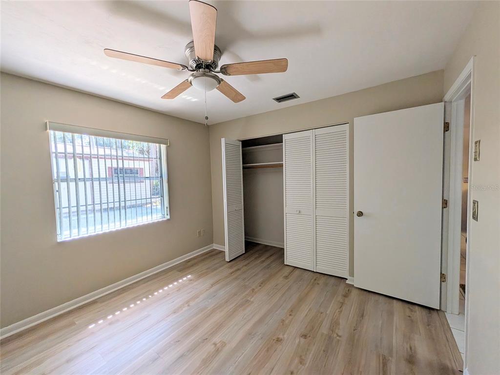 148 Serena Road DeBary, FL 32713 - Photo 15 of 25 a view of an empty room with wooden floor and a window