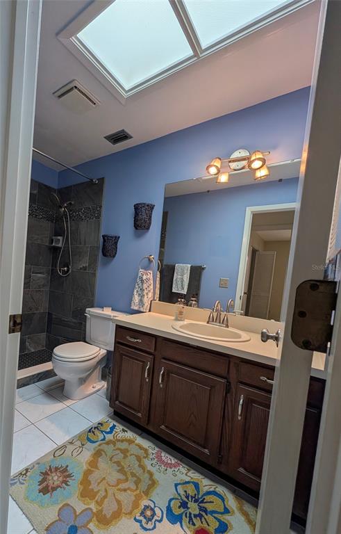 148 Serena Road DeBary, FL 32713 - Photo 17 of 25 a bathroom with a sink mirror vanity and toilet