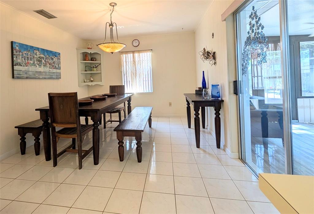 148 Serena Road DeBary, FL 32713 - Photo 7 of 25 a view of a dining room with furniture and window