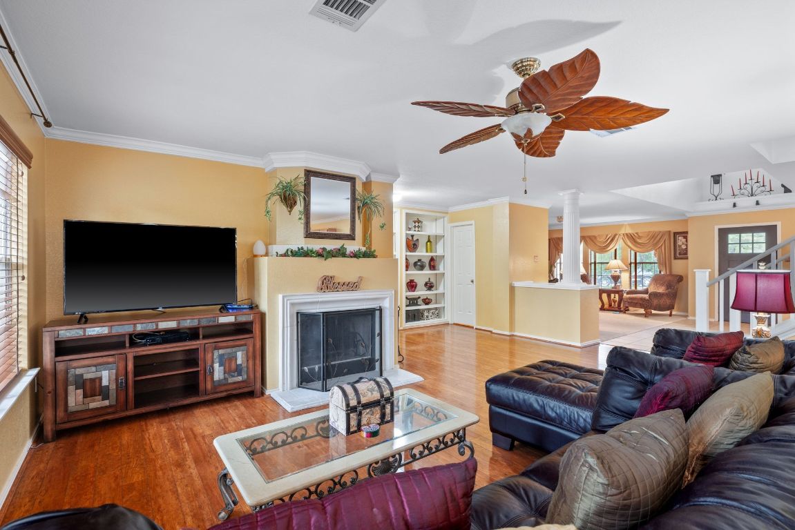 2210 Rachel Ridge Cedar Park, TX 78613 - Photo 12 of 40 a living room with furniture a flat screen tv and kitchen view