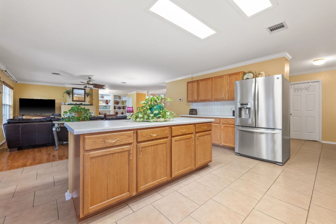 2210 Rachel Ridge Cedar Park, TX 78613 - Photo 18 of 40 a kitchen with granite countertop a refrigerator and a sink