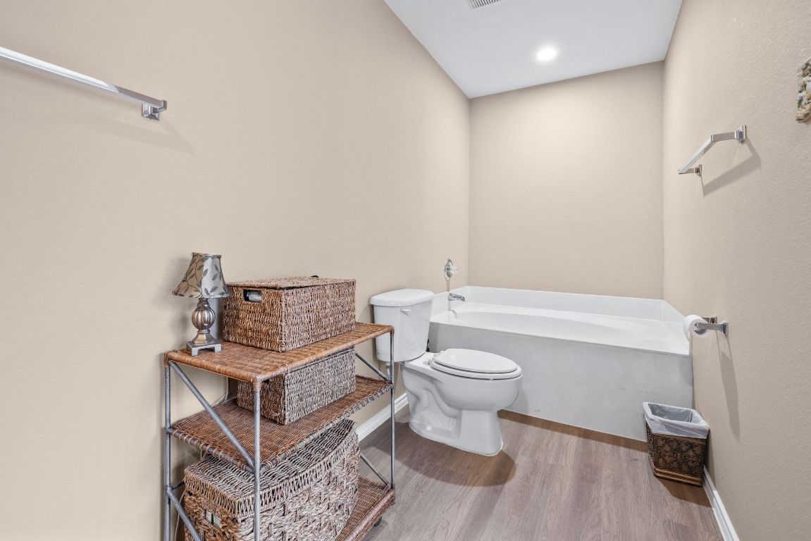 2210 Rachel Ridge Cedar Park, TX 78613 - Photo 26 of 40 a bathroom with a toilet a sink and mirror