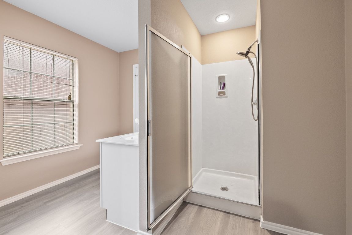 2210 Rachel Ridge Cedar Park, TX 78613 - Photo 27 of 40 a bathroom with a bathtub and a shower