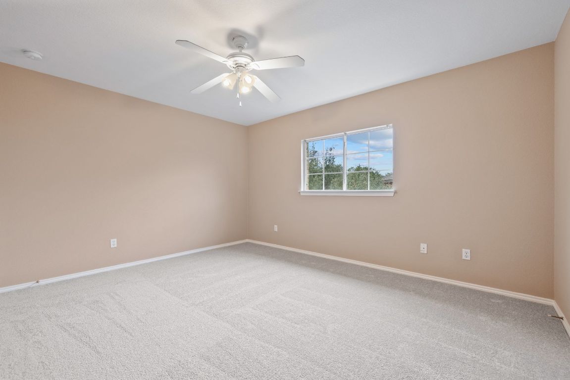 2210 Rachel Ridge Cedar Park, TX 78613 - Photo 32 of 40 an empty room with windows and fan