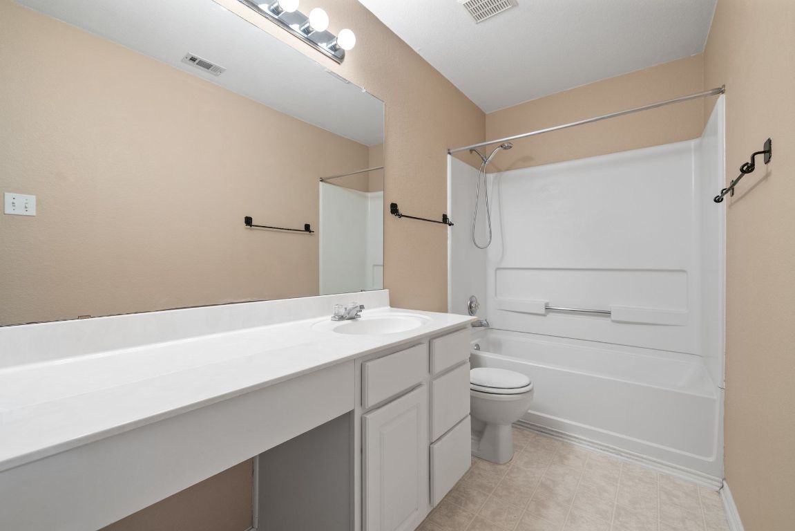 2210 Rachel Ridge Cedar Park, TX 78613 - Photo 33 of 40 a bathroom with a sink a toilet and shower