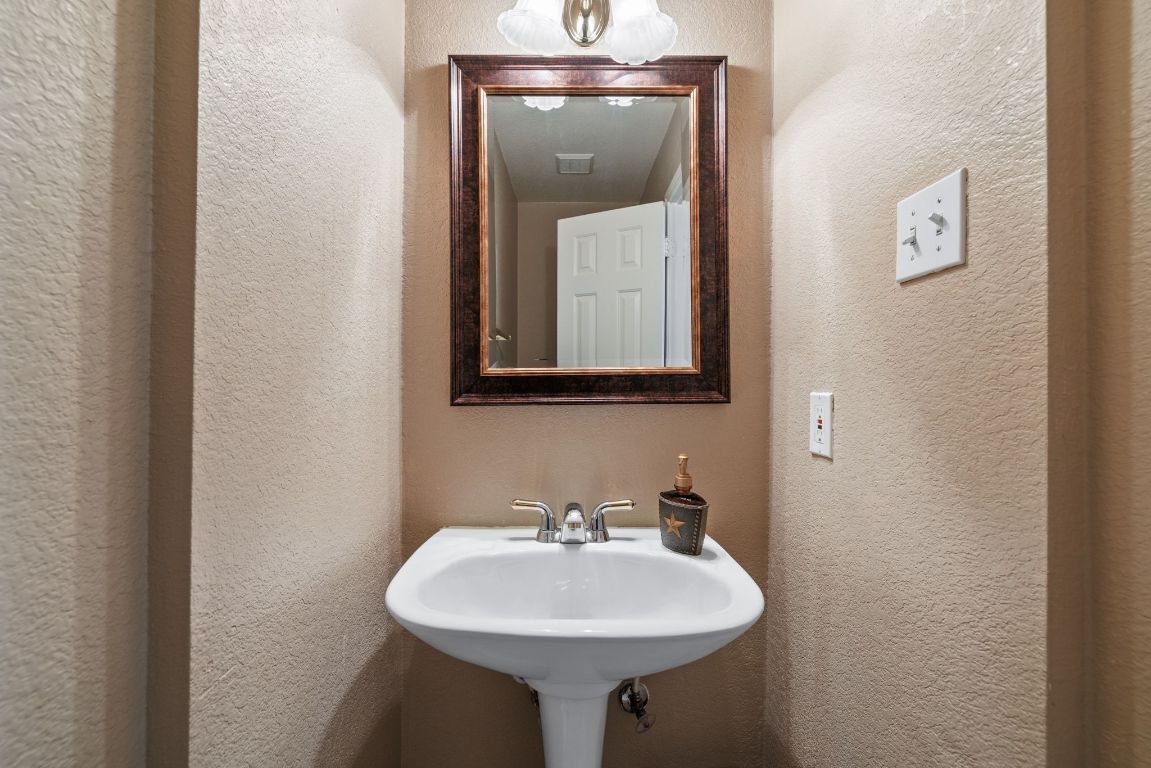 2210 Rachel Ridge Cedar Park, TX 78613 - Photo 35 of 40 a bathroom with a sink and a mirror