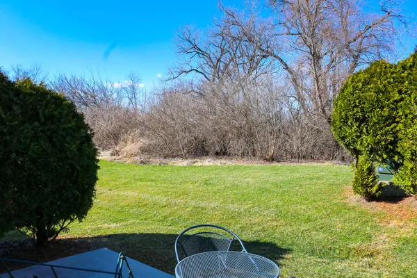 a backyard of a house with lots of green space