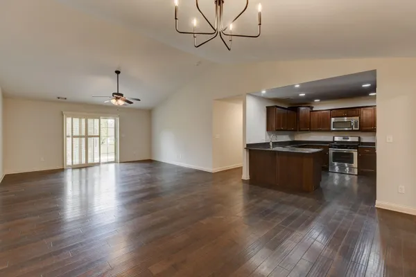 a view of kitchen with sink microwave and stove