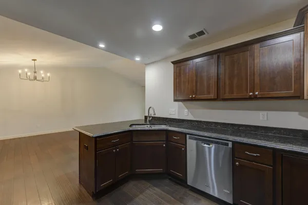 a kitchen with a sink and cabinets