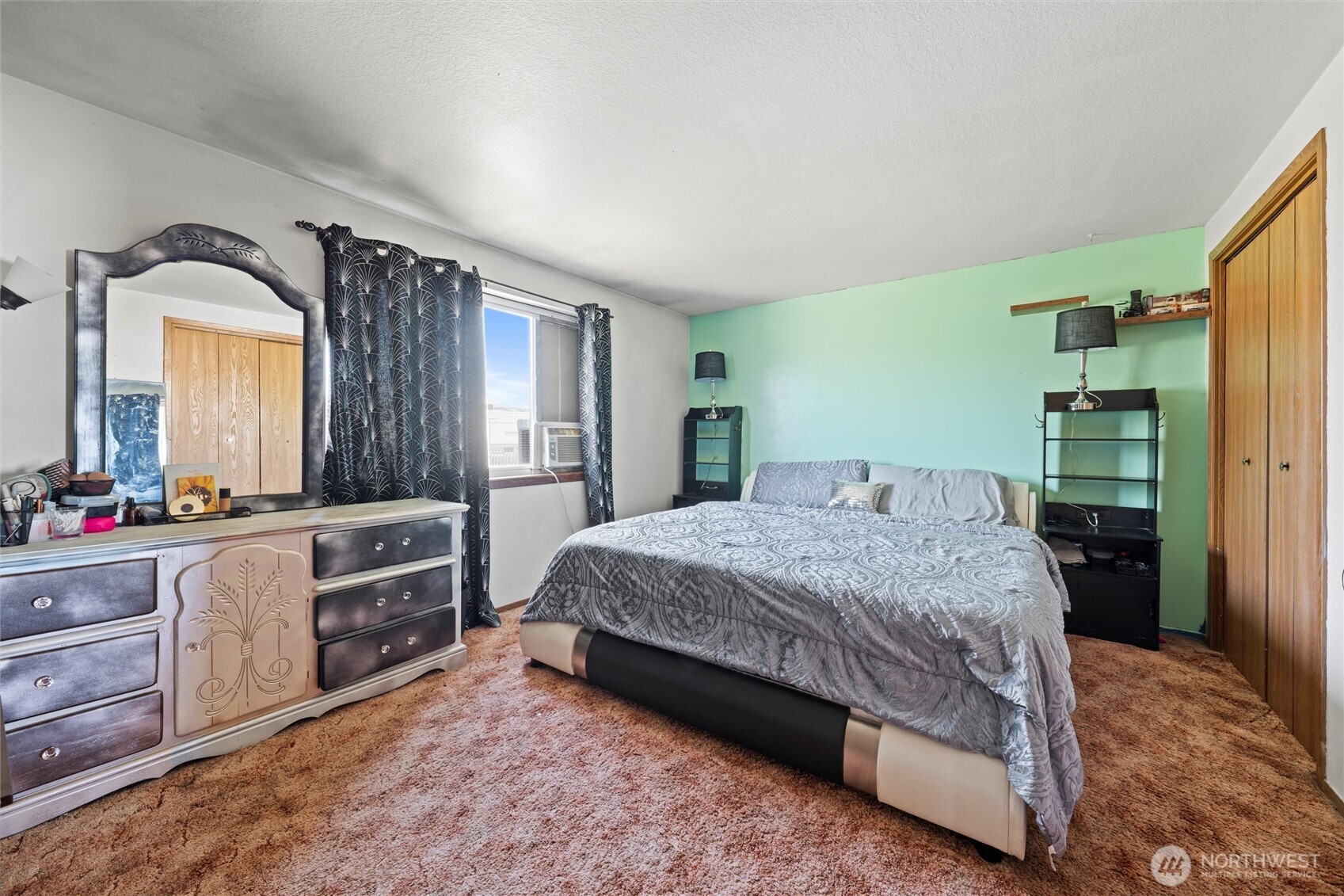 411 North Wahl Road Lind, WA 99341 - Photo 11 of 31 a bedroom with a bed and dresser with mirror
