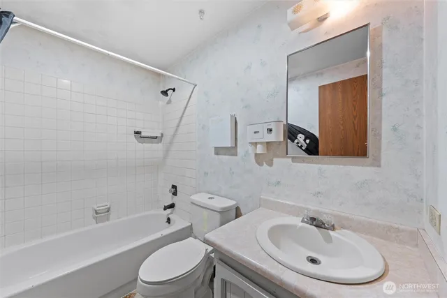 a view of a bathroom from a hallway